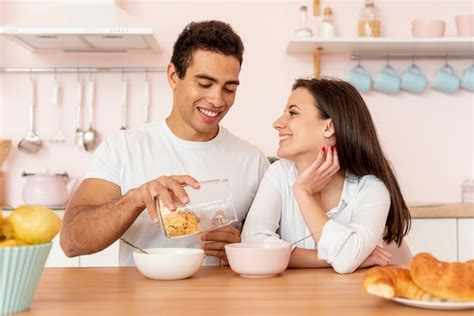 Free Photo Couple Having Breakfast In The Kitchen