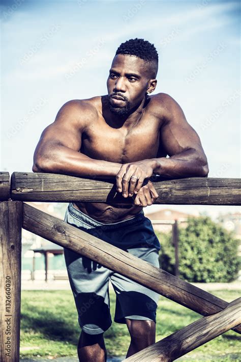 Muscular Shirtless Hunky Black Man Outdoor In City Park Showing