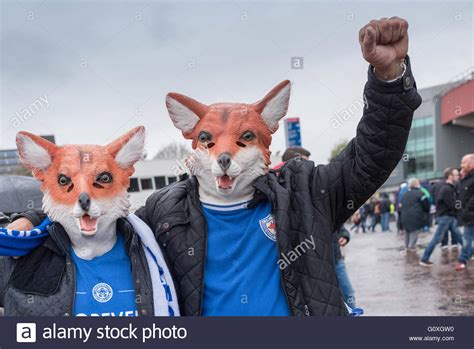 Leicester City Football Fans Wearing Foxes Masks Stock Photo Alamy