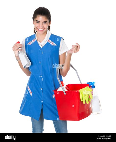 Portrait Of Happy Female Worker Carrying Bucket With Cleaning Equipment