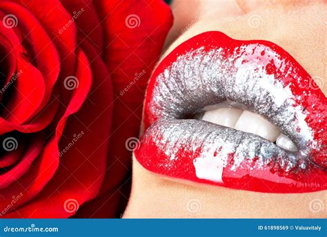 Beautiful Female Lips With Shiny Lipstick And Red Rose Stock Image