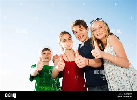 Four Happy Teenage Friends Outdoors Stock Photo Alamy