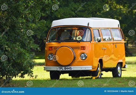 Classic Orange Vw Camper Van Parked On Village Green Editorial Stock