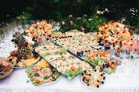 Premium Photo Beautifully Decorated Banquet Table With Salads Sweets