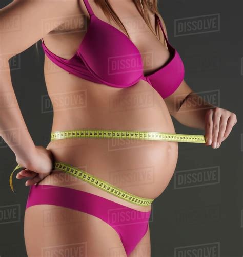 Pregnant Woman Measuring Belly Stock Photo Dissolve
