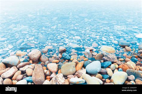 River Stones Or Pebbles On The River Shore And Water Stock Photo Alamy