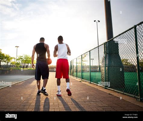 Rear View Of Basketball Players Walking In Court Stock Photo Alamy