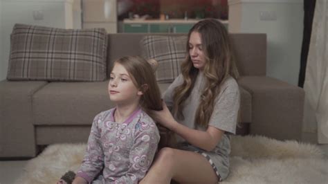 Older Sister Combing Hair Of Younger Girl Stock Footage Sbv 330982245 Storyblocks