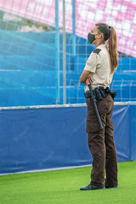 Premium Photo Female Security Guard Visually Surveying At An Outdoor