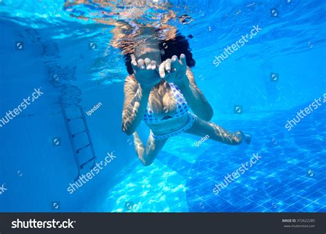 Underwater Shot Of Girl With Big Breast In Swimming Pool Stock Photo
