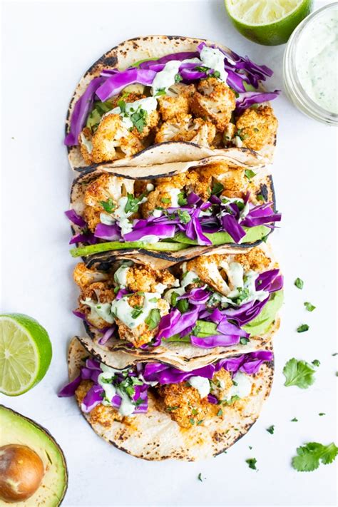 roasted cauliflower tacos are topped with a vegan cilantro lime cream sauce for a gluten free
