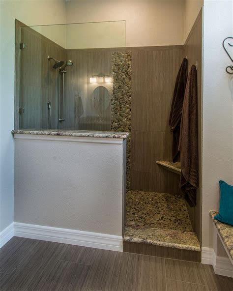 This Master Bathroom Features A Walk In Shower With A Partial Glass