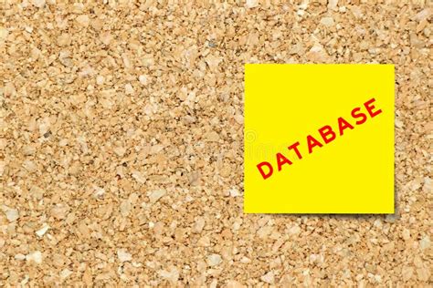 Yellow Note Paper With Word Database On Cork Board With Copy Space