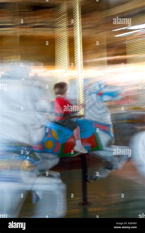 Young Children Ride On Merry Go Round Hi Res Stock Photography And