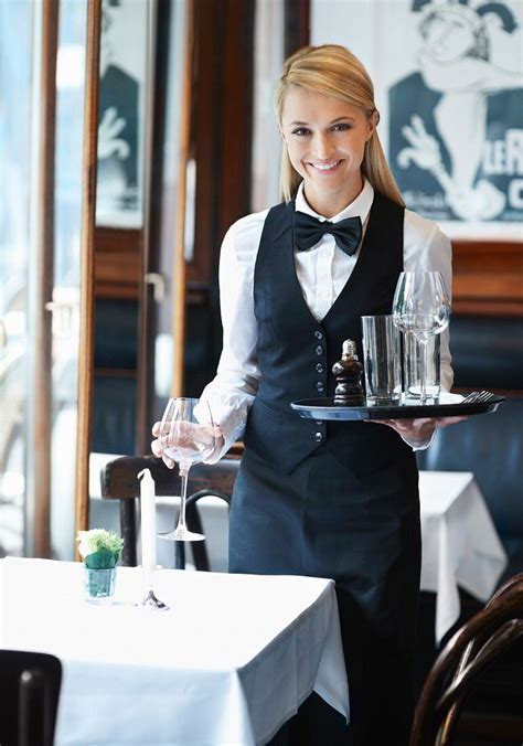 A Waitress Setting Out Glasses At A Pub License Images 11170996