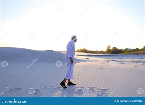 Confident Guy Arab Walks In Middle Of White Desert And Enjoys L Stock
