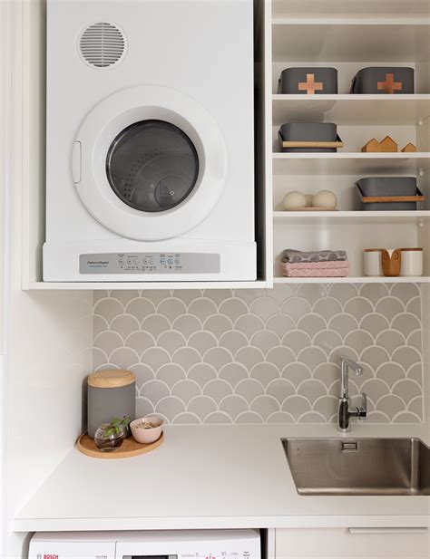 This cupboard laundry achieves style and practicality in a small space