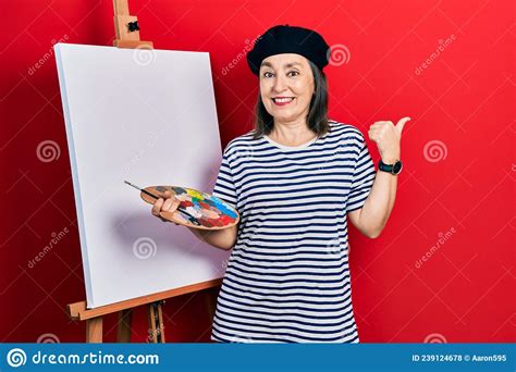 Middle Age Hispanic Woman Standing Drawing With Palette By Painter