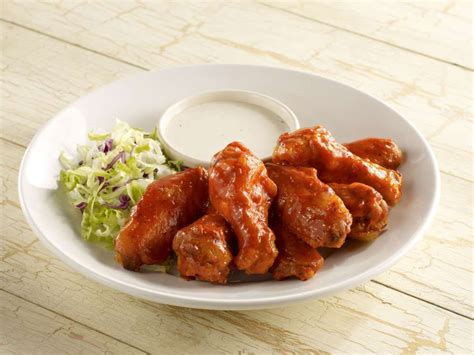 Although the flavour of bbq chicken wings does vary depending on the marinade ingredients used, we are sticking with garlic, ginger, honey, oyster sauce and sesame oil here, because those flavours combine beautifully and the resulting wings are simply fantatic. Spicy chicken wings served with ranch dressing and slaw - John E. Kelly/Getty Images | Chicken ...