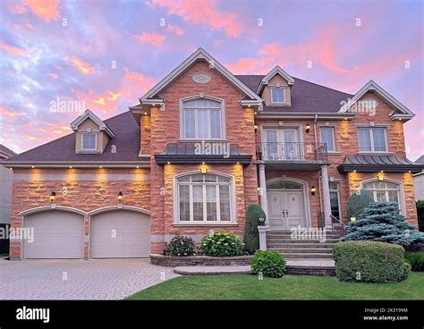 Luxury Home Exterior At Sunset Stock Photo Alamy