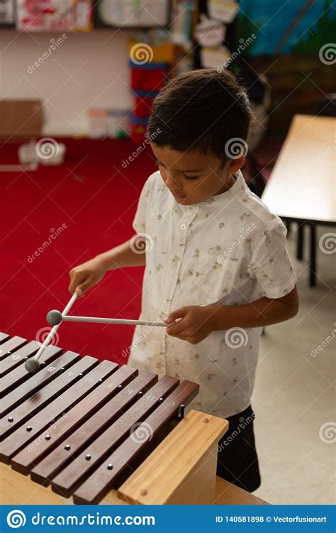 Schoolboy Playing Xylophone In A Classroom Stock Photo Image Of Boys