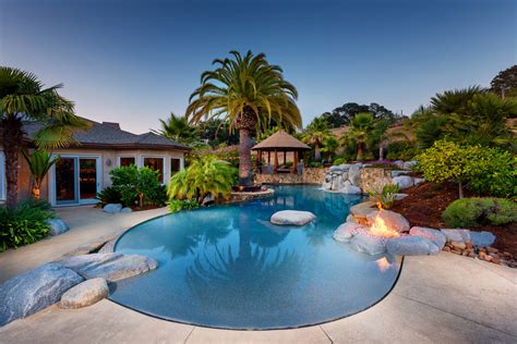 20 Mesmerizing Tropical Swimming Pool Designs That Will Take Your
