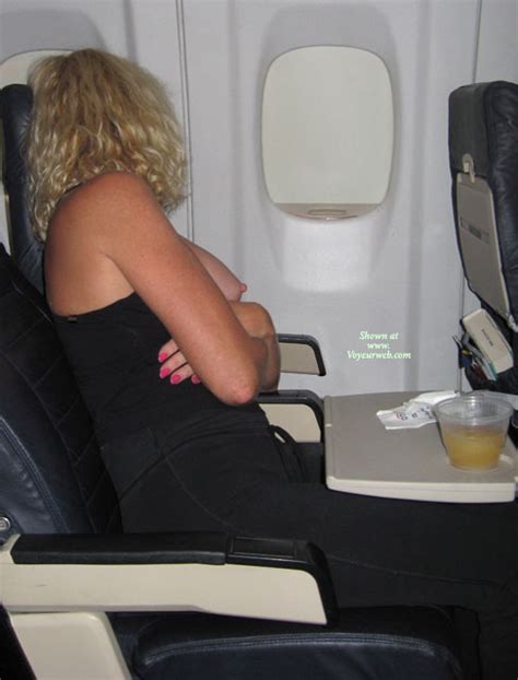 Naughty Blond With Curls Exposing Tits On An Airplane February 2008