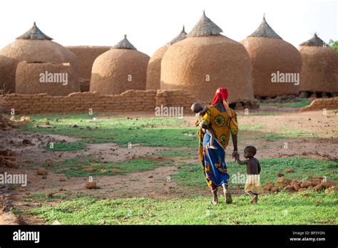 Zantaram Villageniger A Mother Walks Home Past Empty Grain Stores