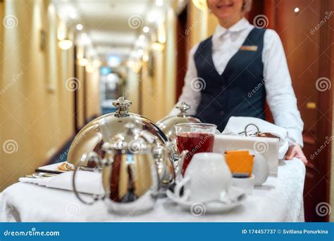 All That You Need Waitress In Uniform Delivering Tray With Food In A