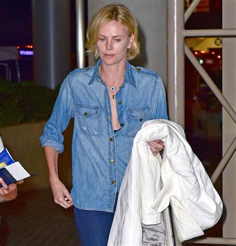 charlize theron flashes huge diamond ring as rumours spread she is set to marry sean penn
