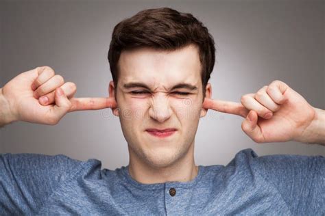 Man Putting Fingers In Ears Stock Image Image Of Young People 30964897