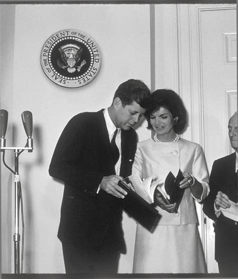 President And Mrs Kennedy With The Historic Guide White House