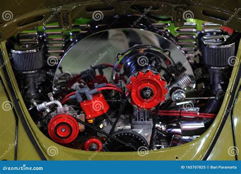 Volkswagen Beetle With An Engine That Has Been Restored And Modified