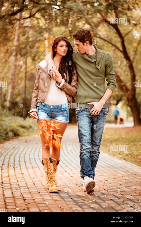 Beautiful Lovely Couple Walking And Enjoying In The Park In Autumn