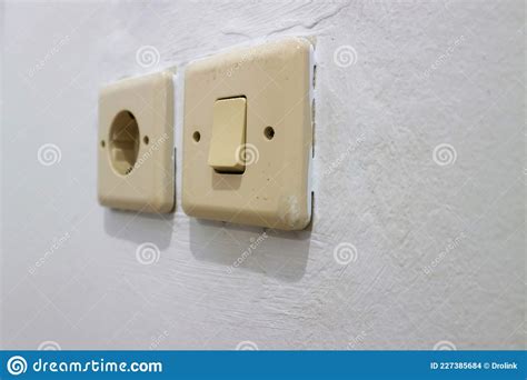 Light Switch And Electric Plug On The Wall Stock Photo Image Of