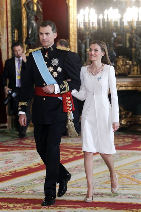 Queen Letizia Sports A Simple White Coat And Dress With A Touch Of Embellishment For Her