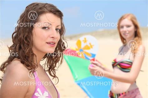 two teenage girls at the be by angel nieto mostphotos