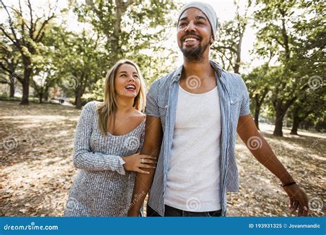 Pportrait Of Romantic And Happy Mixed Race Young Couple In Park Stock