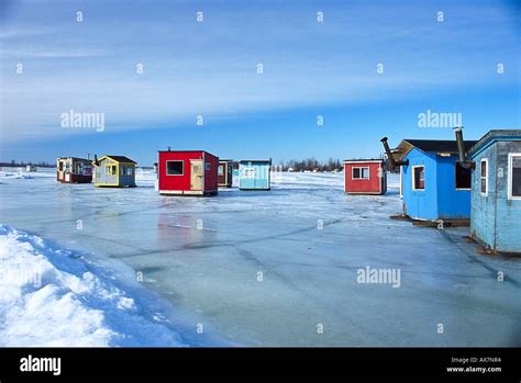 Ice Fishing Cabins Standing On Frozen St Lawrence River Quebec Stock