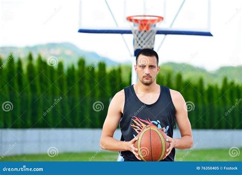 Basketball Player With Ball At The Outdoors Basket Court Stock Image