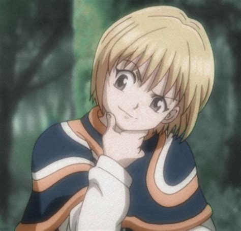 An Anime Character With Blonde Hair Wearing A Blue And White Shirt In