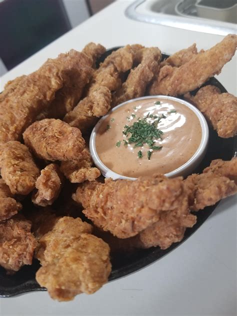 homeade double beer battered chicken tenders with paprika and garlic infused fancy sauce r