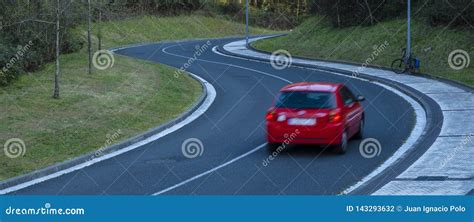 Red Car Driving Fast On The Curve Of Road Stock Photo Image Of Color