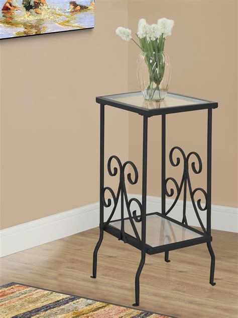 The fissure table is made of a reclaimed teak wood top that has been encased with acrylic and accented with clear glass shards to create a floating visual epiphany of style and d_cor. Black Metal and Tempered Glass Accent Table from Monarch ...