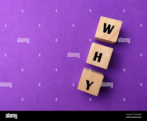Wooden Block With The Word Why On A Purple Background Stock Photo Alamy