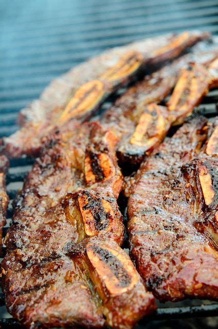 Carrot, cucumber, doenjang, garlic, ginger, gochujang, green chili pepper, green onion, ground black pepper, honey, korean pear, la galbi beef short ribs, lettuce, perilla leaves, sesame seeds, soy sauce, toasted sesame oil, water. Korean Kalbi~teriyaki short ribs grilled on open flame ...