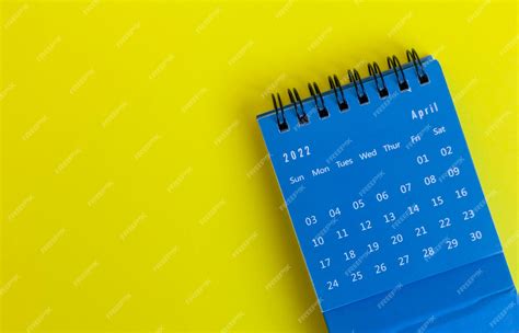 Premium Photo Desktop Blue Calendar For April 2022 For Planning On A