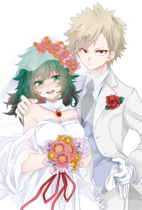 Two People Dressed Up In Wedding Clothes And Holding Each Others Hands