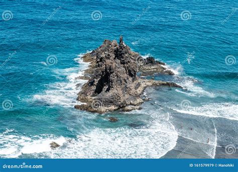 Black Rock In Ocean Waves Near Beach Aerial Stock Image Image Of