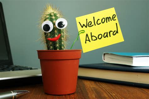 Welcome Aboard Concept Funny Cactus On Workplace In The Office